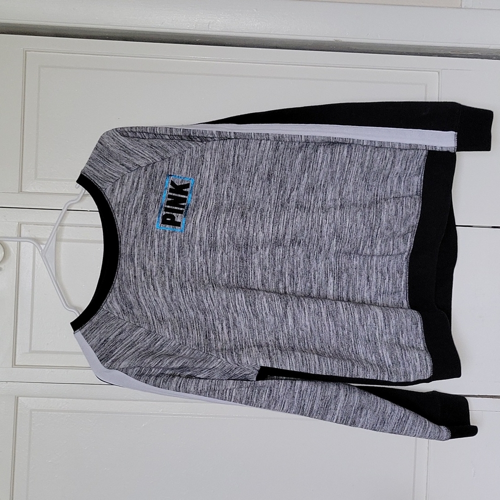 PINK gray and black sweatshirt.